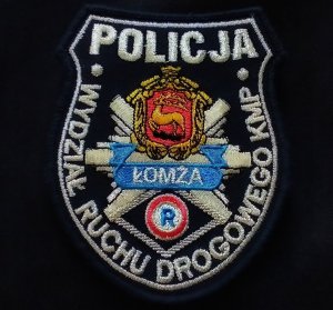 Emblemat Wydziału Ruchu Drogowego Komendy Miejskiej Policji w Łomży.